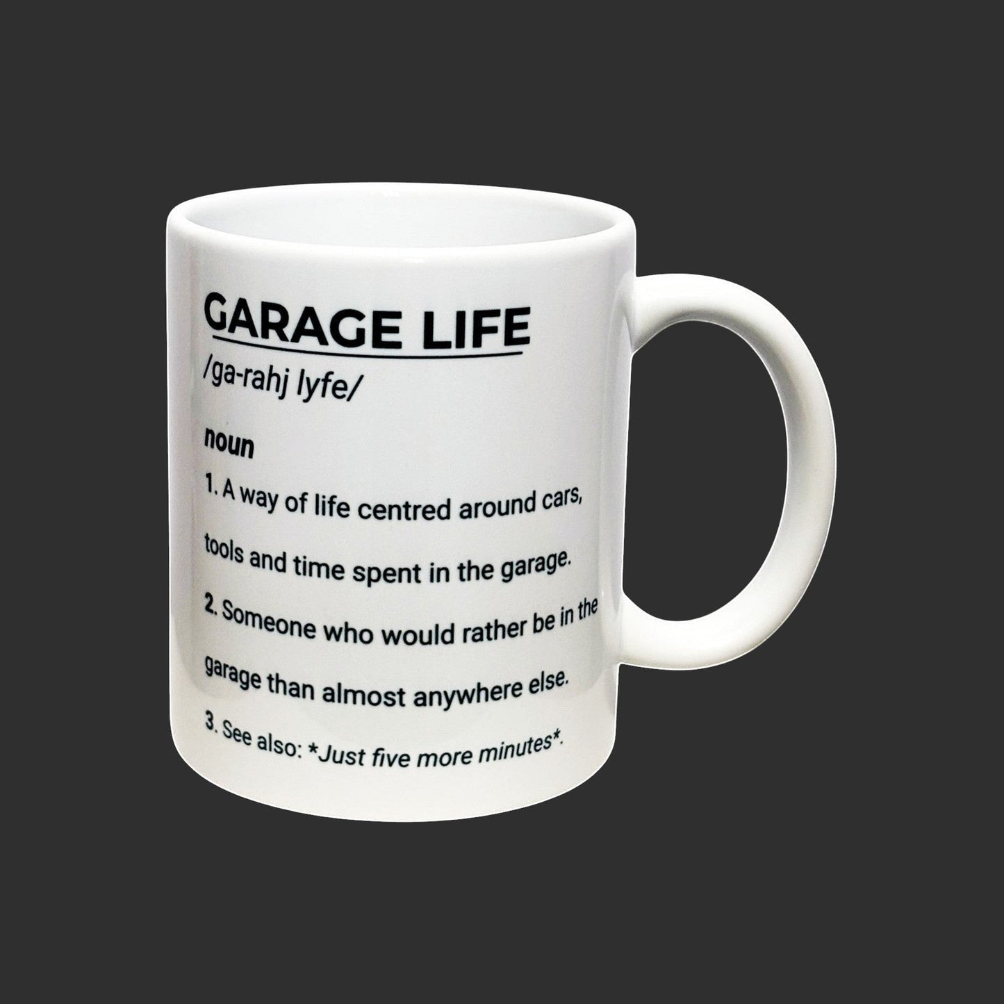 Illustrated Solutions Store white ceramic mug with black text defining "Garage Life" as a way of life centred around cars, tools, and time spent in the garage.