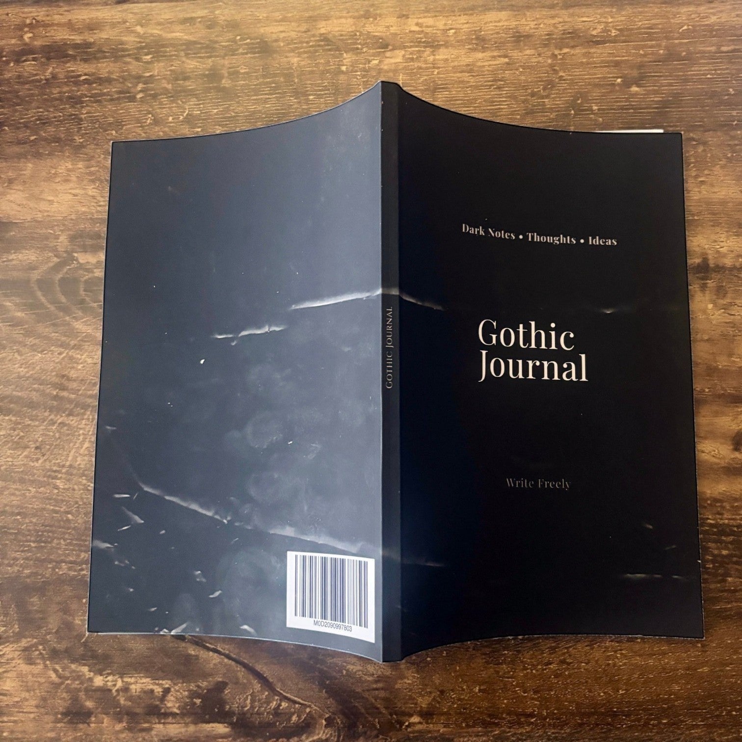 Illustrated Solutions Store Gothic Journal with a dark, marbled cover and 'Gothic Journal' title. Perfect for notes and sketches.