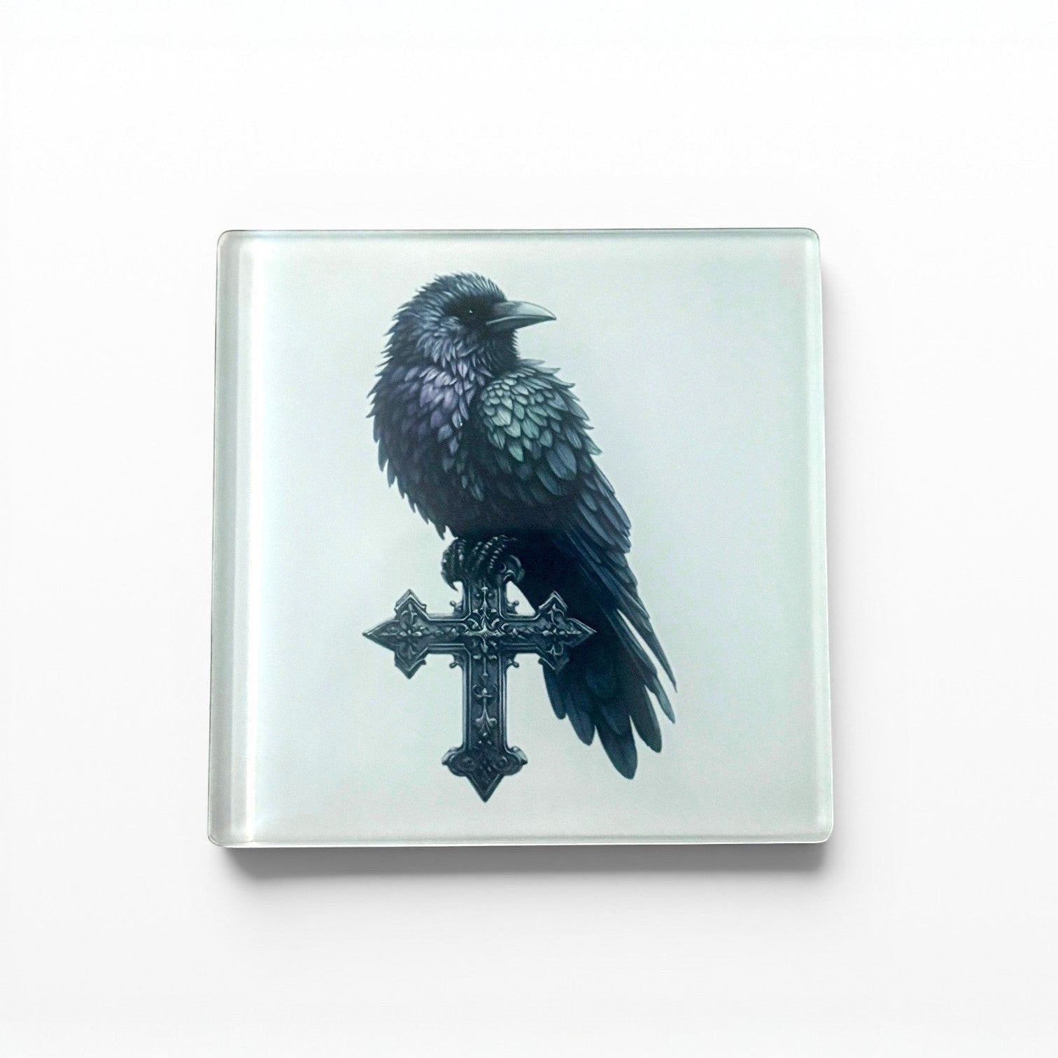 Illustrated Solutions Store gothic glass coaster with a black raven perched on an ornate cross.