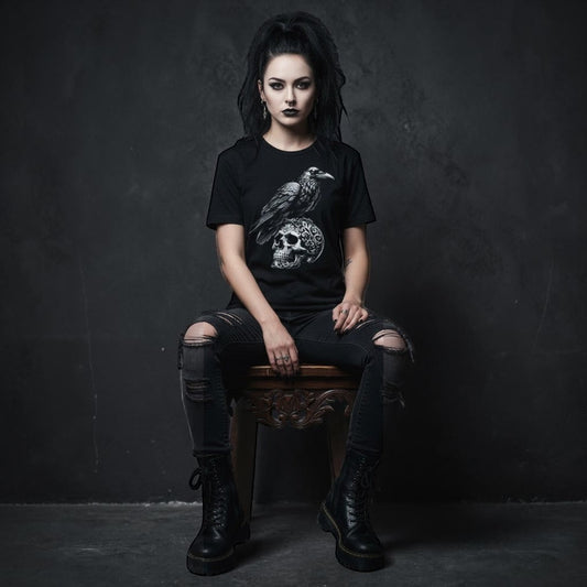 Illustrated Solutions Store black gothic t-shirt with a detailed raven perched on an ornate skull graphic.