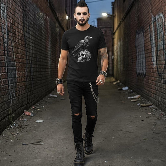 Illustrated Solutions Store black gothic t-shirt with a detailed raven perched on an ornate skull graphic. Unisex fit, monochrome design.
