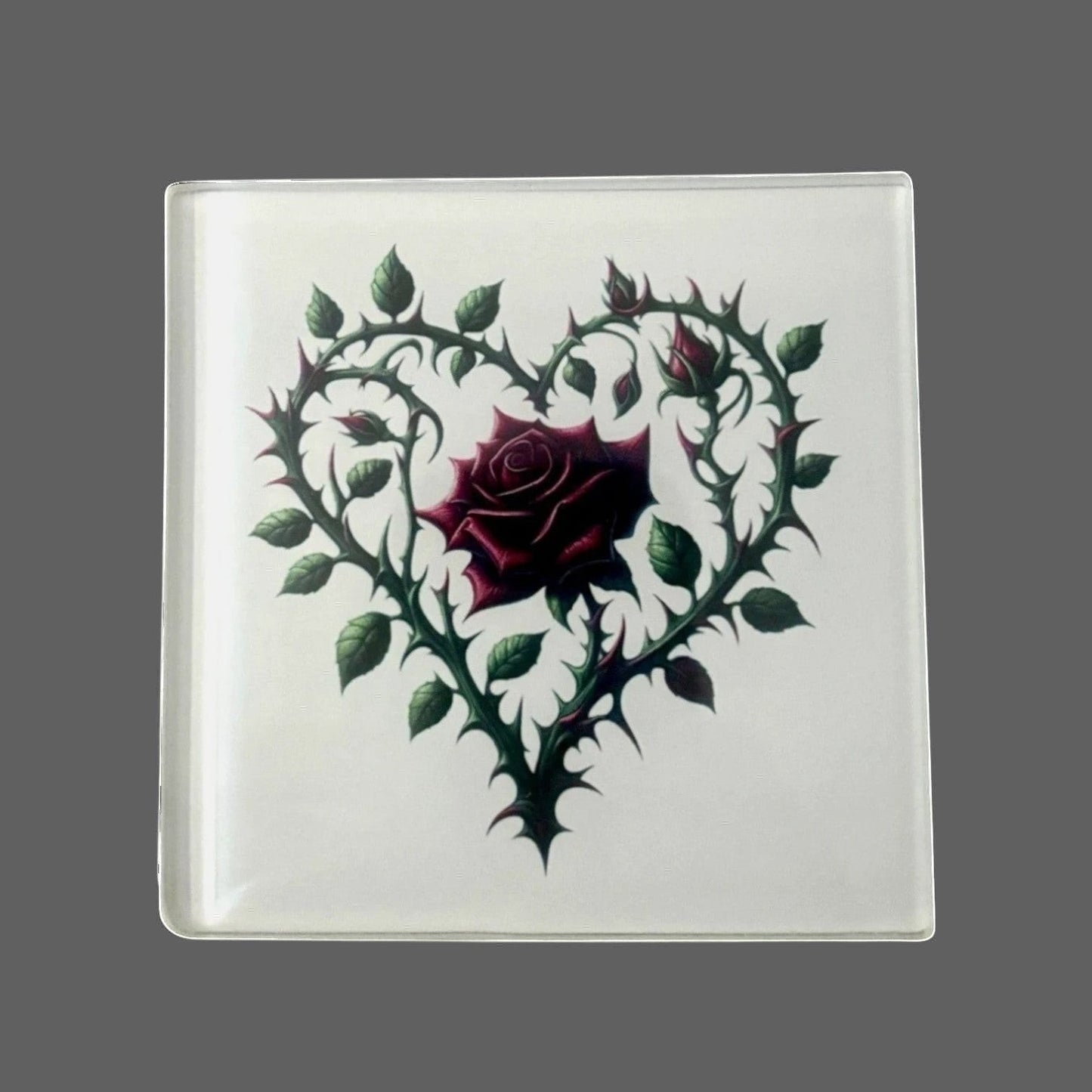 Illustrated Solutions Store gothic thorn rose heart glass square coaster with a deep red rose.