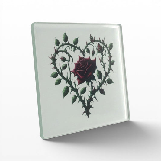 Illustrated Solutions Store gothic thorn rose heart glass coaster. Features a dark red rose surrounded by thorny vines forming a heart shape.
