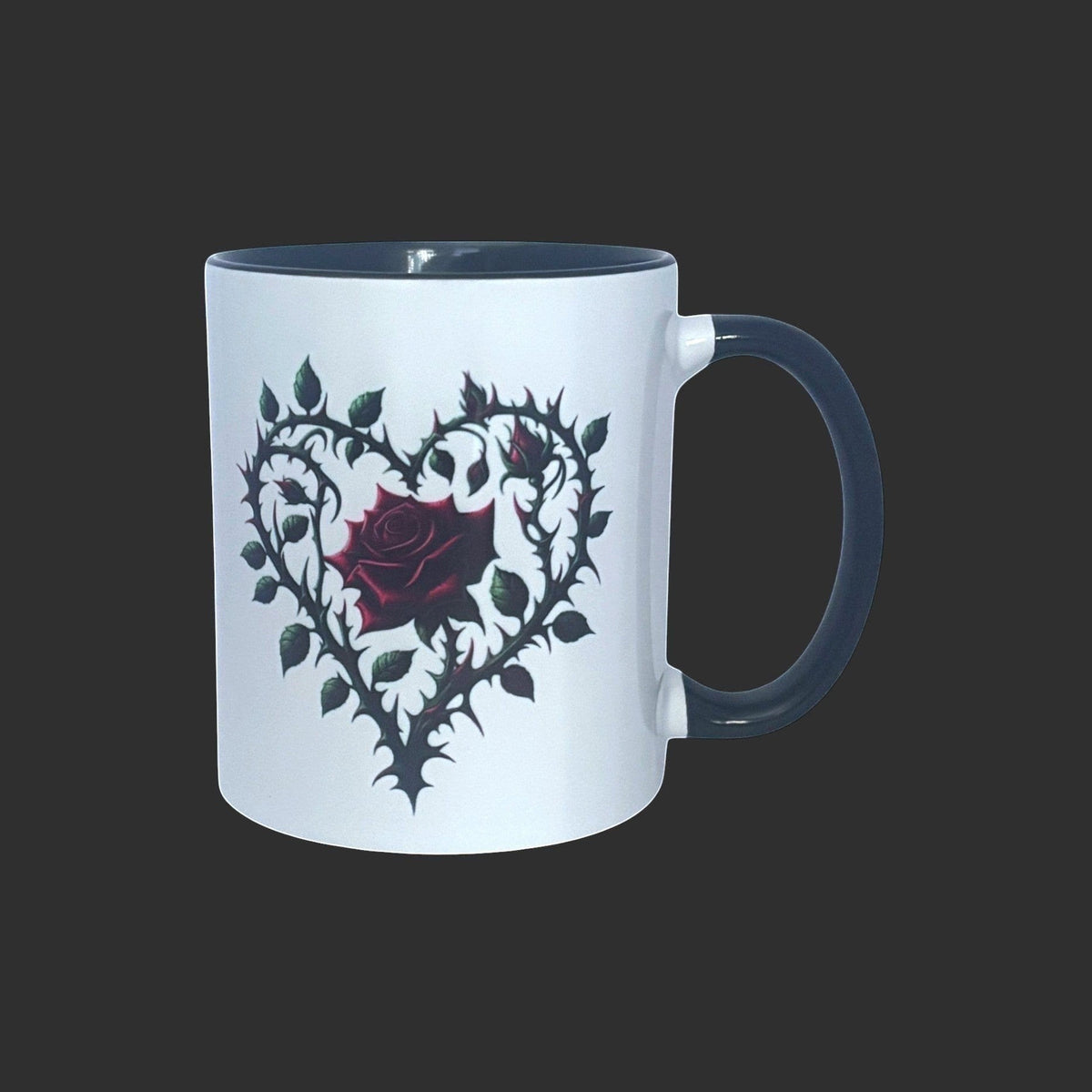 White mug with a black heart design featuring a red rose on a black background