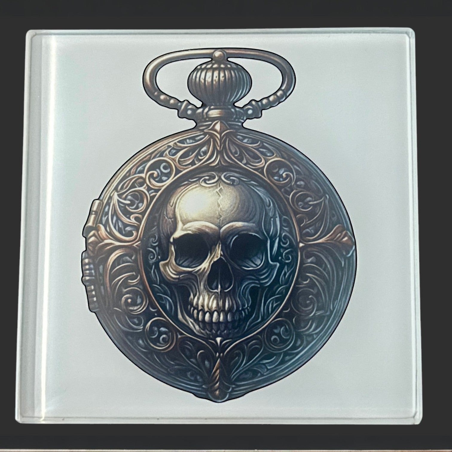 Illustrated Solutions Store gothic glass coaster with skull in ornate pocket watch design.