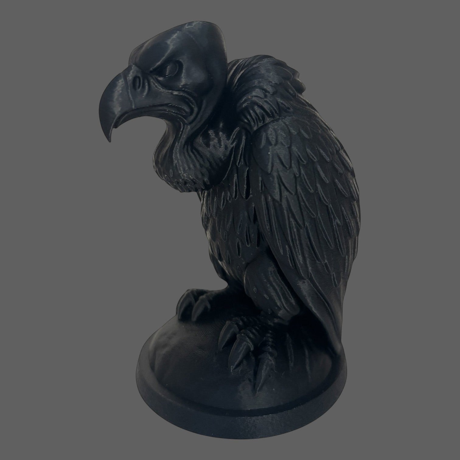 Illustrated Solutions Store black gothic vulture figurine with detailed feathers and menacing expression, perched on a base.