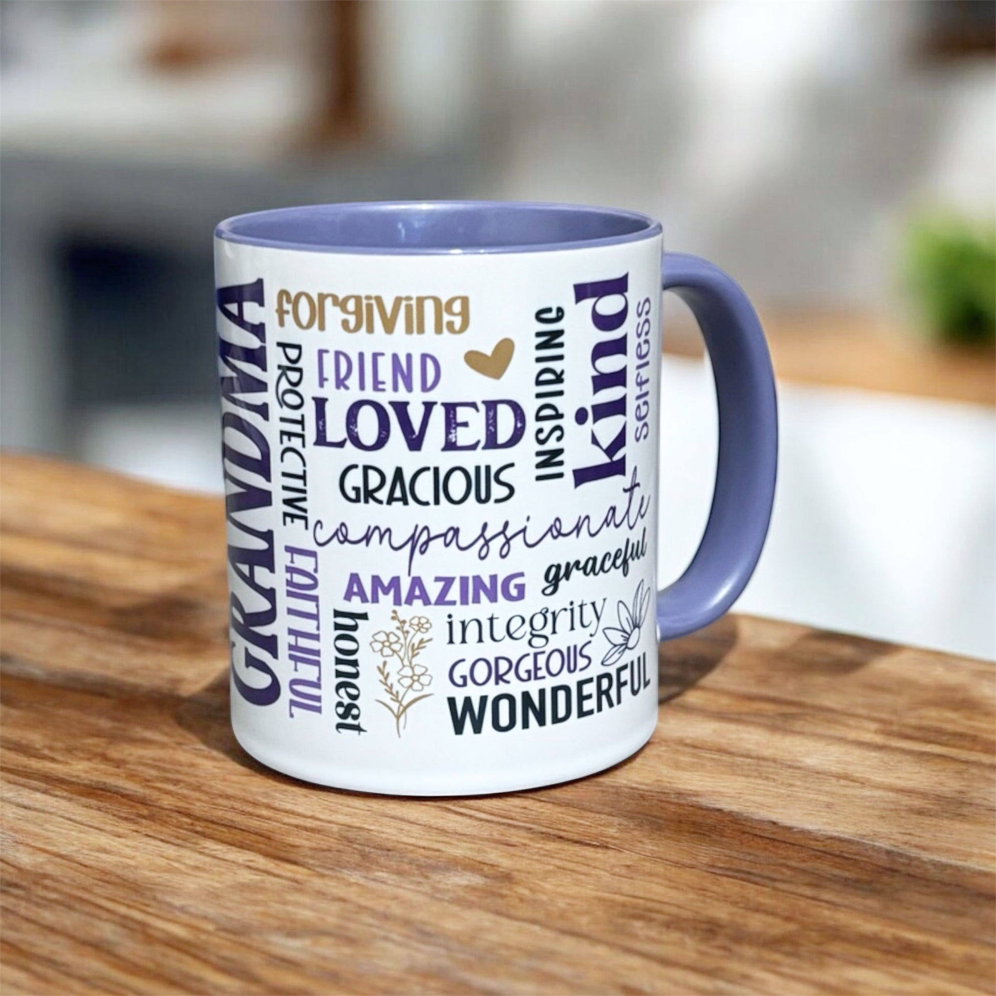 Illustrated Solutions Store white ceramic mug with purple interior and handle, featuring the word "Grandma" vertically and a word cloud of positive adjectives like "loved," "kind," and "amazing."