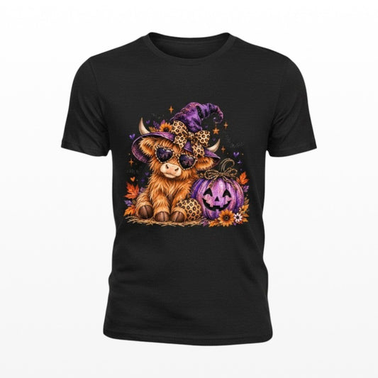 Illustrated Solutions Store black unisex t-shirt featuring a fluffy Highland cow in a witch hat and sunglasses.