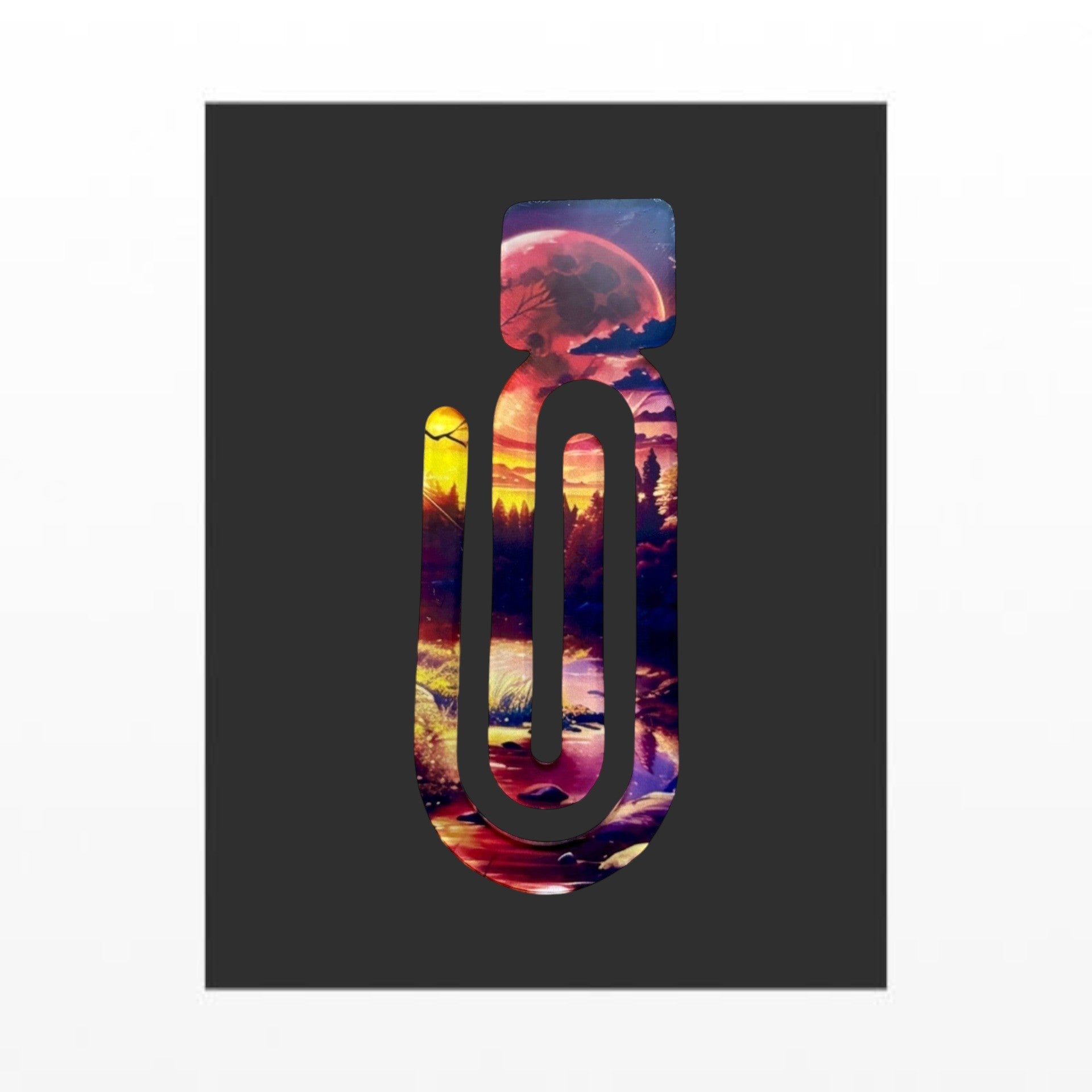 Illustrated Solutions Store Into The Woods acrylic book clip with a vibrant forest sunset and moon design.