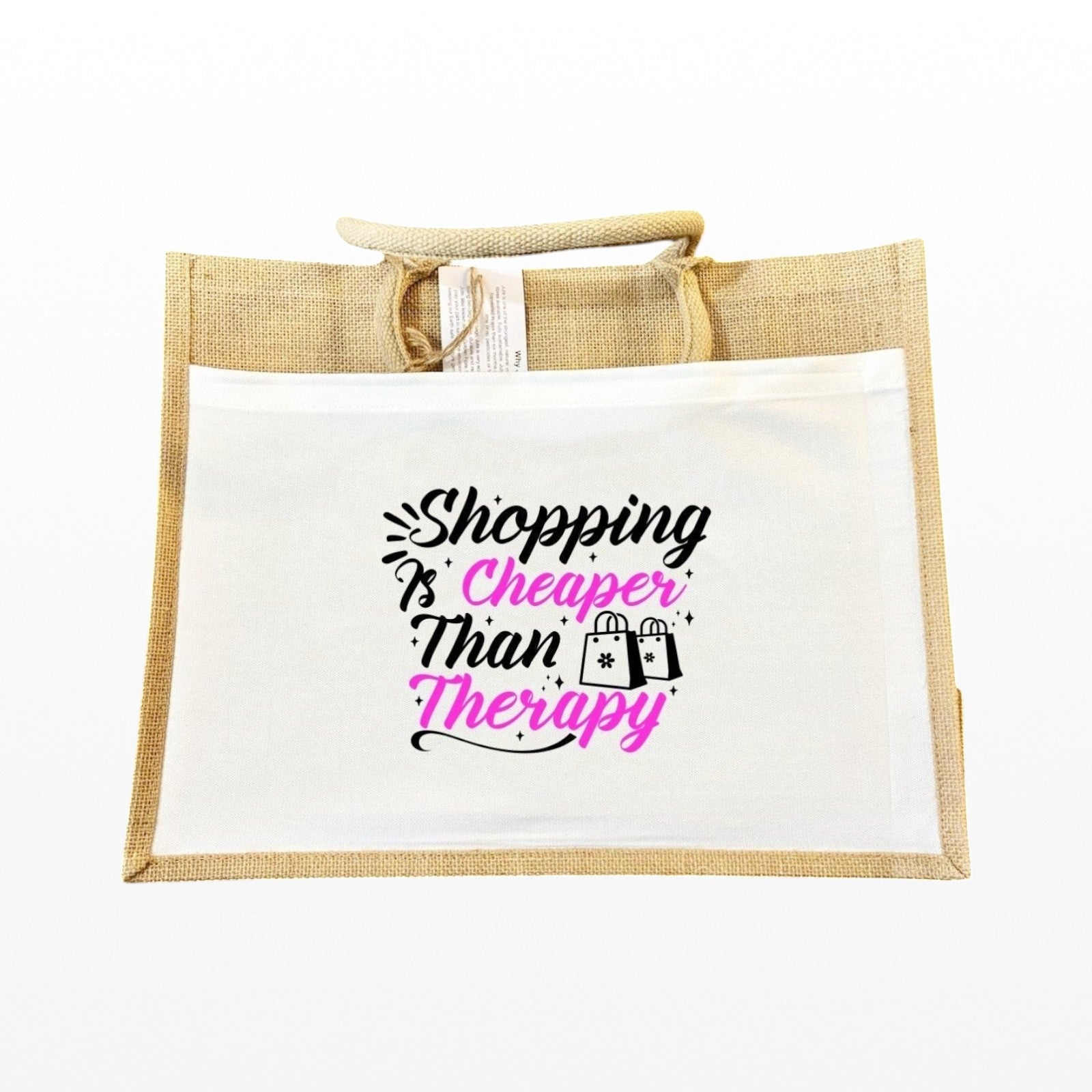 Illustrated Solutions Store jute tote bag with Shopping Is Cheaper Than Therapy slogan in black and pink text.