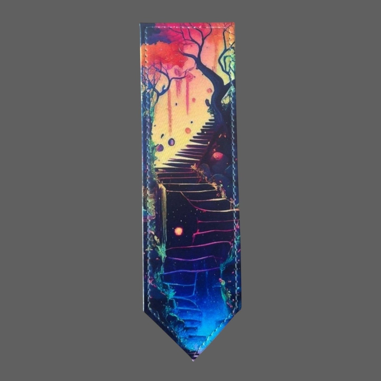 Illustrated Solutions Store leather bookmark featuring a surreal dreamscape stairway with vibrant colours and glowing orbs.