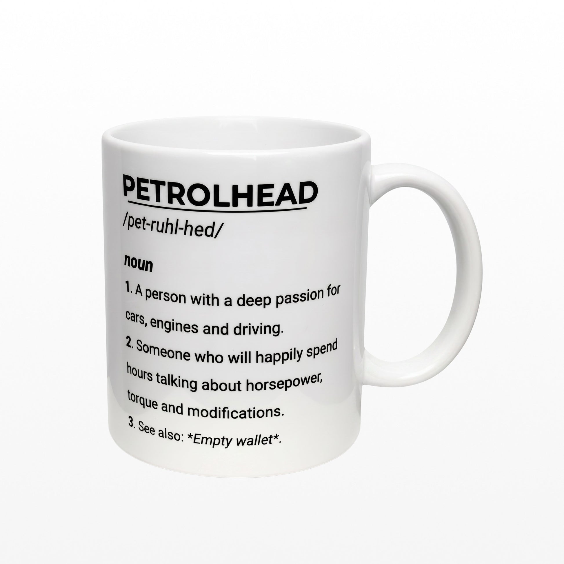 Illustrated Solutions Store white ceramic mug featuring a humorous dictionary definition of a petrolhead for car lovers.