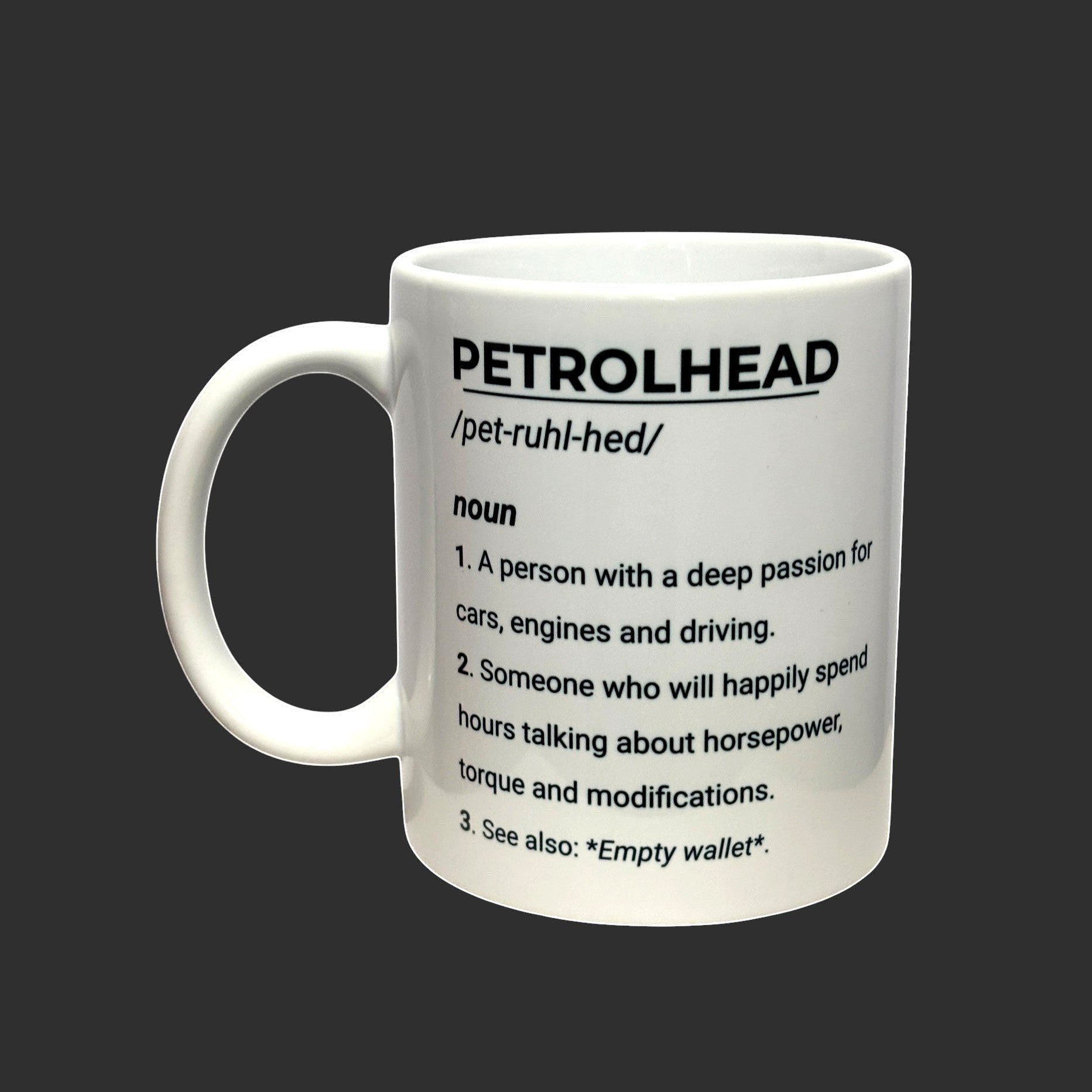 Illustrated Solutions Store white ceramic mug with black text defining 'Petrolhead' as a noun with a deep passion for cars, engines, and driving.