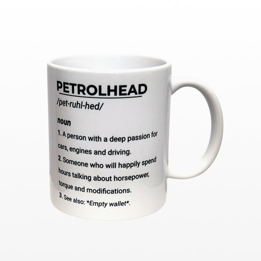 Illustrated Solutions Store white ceramic mug with black text defining 'Petrolhead' as someone with a passion for cars, engines, and driving.