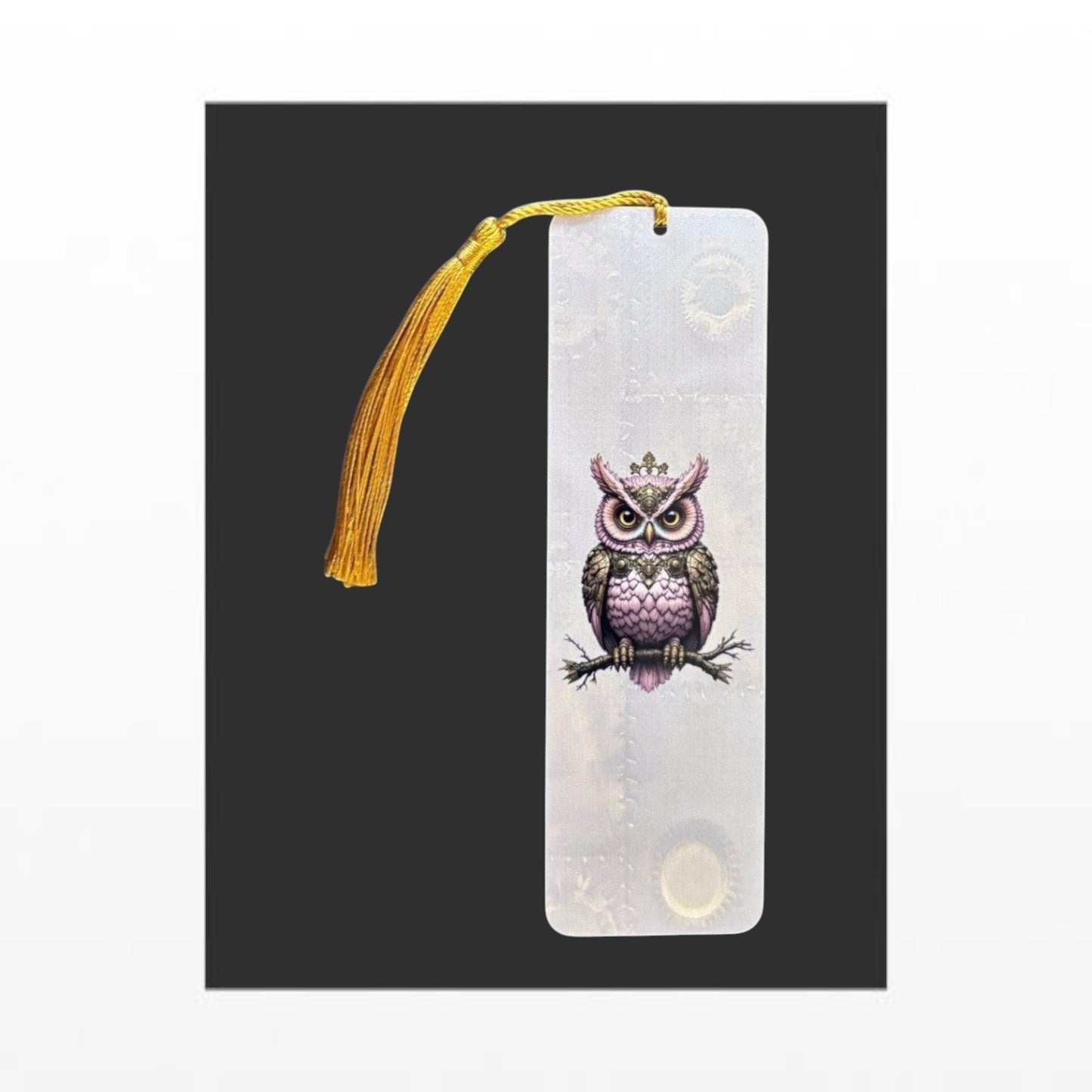 Illustrated Solutions Store pink steampunk owl metal bookmark with a gold tassel and intricate mechanical detailing. Vertical view