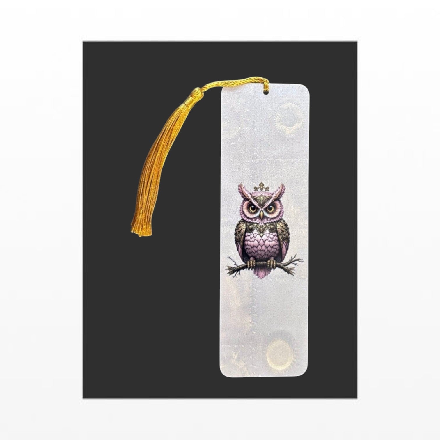 Illustrated Solutions Store pink steampunk owl metal bookmark with a gold tassel and intricate mechanical detailing. Vertical view