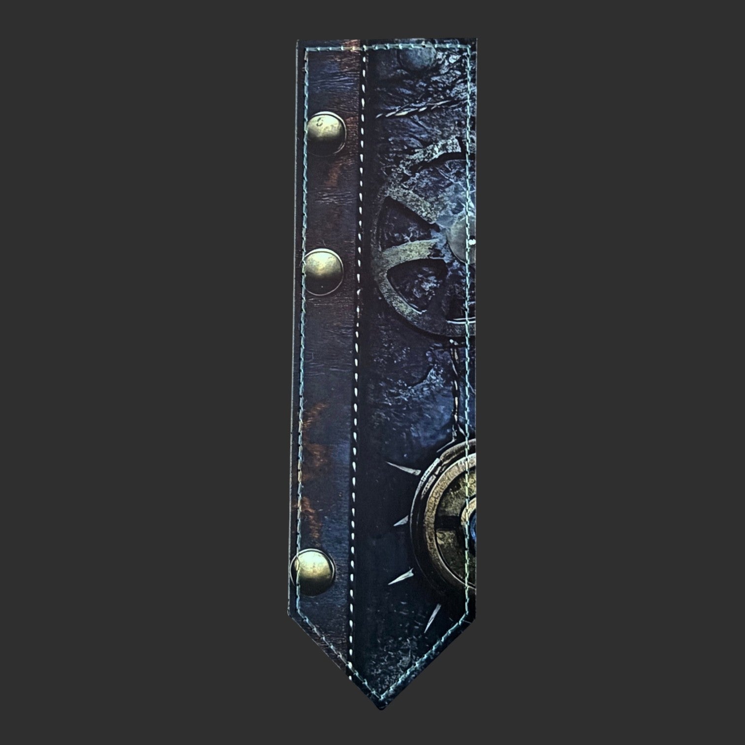 Illustrated Solutions Store steampunk leather bookmark with brass gear details and aged industrial textures.