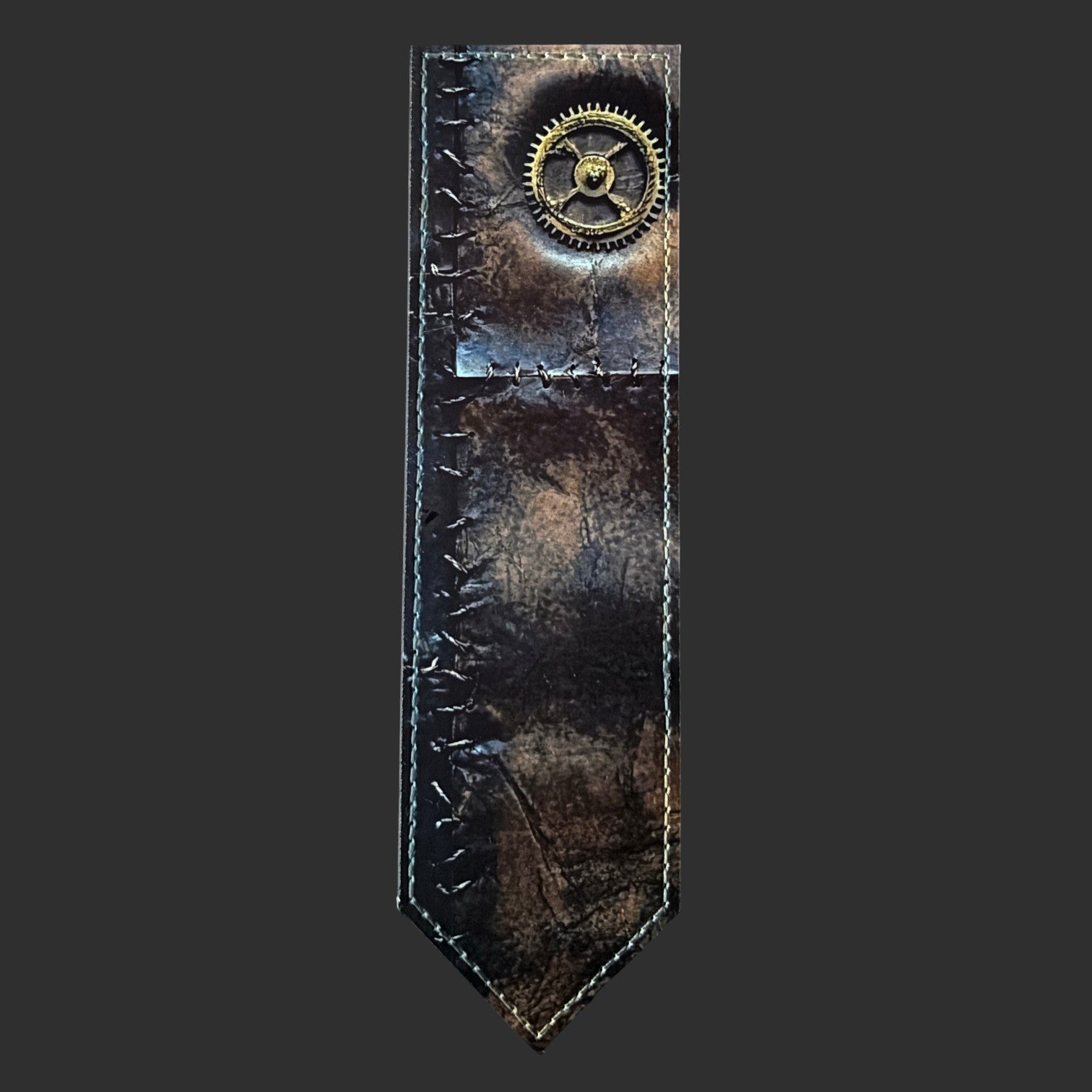 Illustrated Solutions Store steampunk leather bookmark with distressed brown finish, stitched edges, and brass gear detail