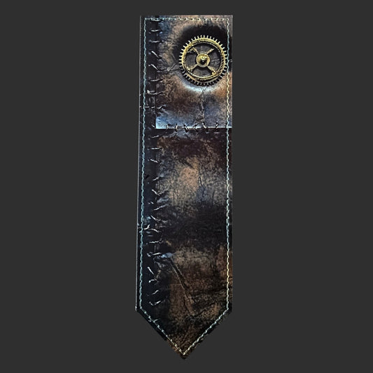 Illustrated Solutions Store steampunk leather bookmark with distressed brown finish, stitched edges, and brass gear detail