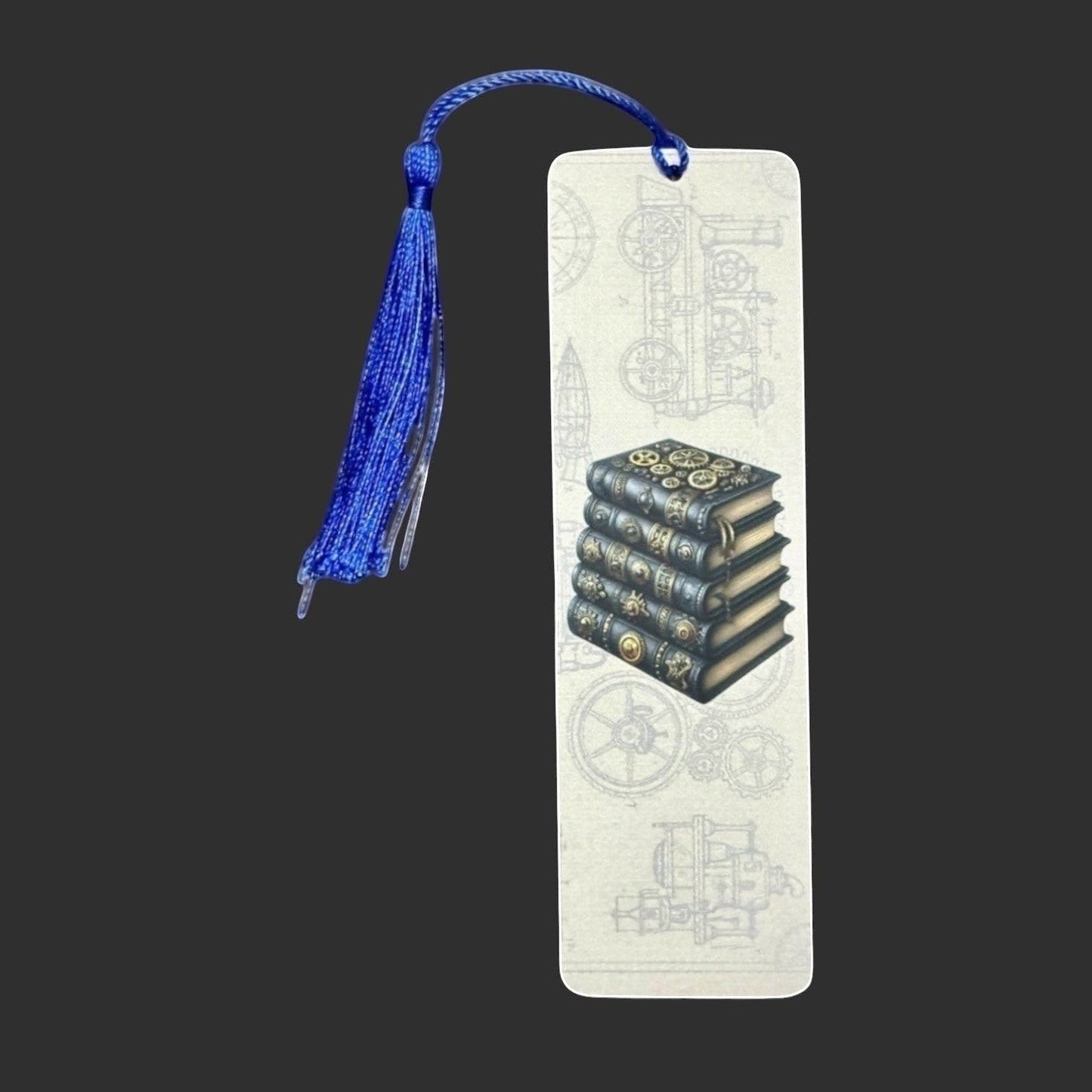 Illustrated Solutions Store steampunk metal bookmark with a stack of ornate books and a blue tassel