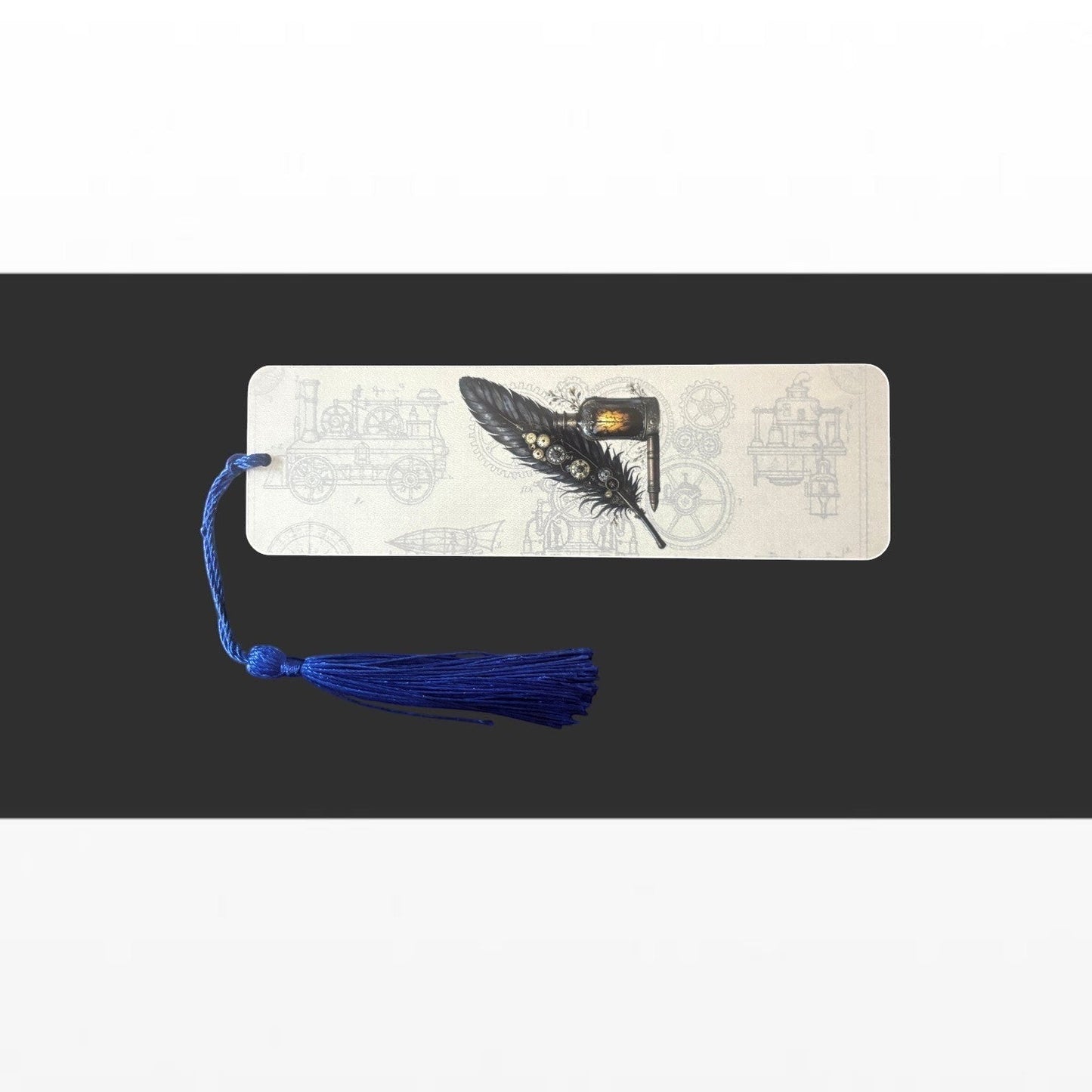 Illustrated Solutions Store steampunk metal bookmark featuring a black quill pen design and a blue tassel.