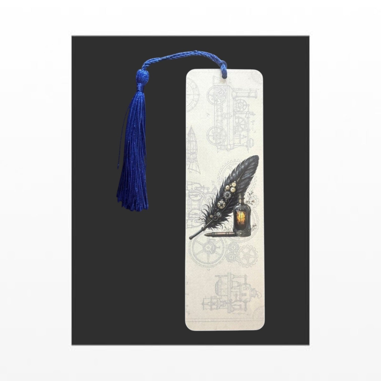 Illustrated Solutions Store steampunk metal bookmark featuring a black writing quill design with a blue tassel.