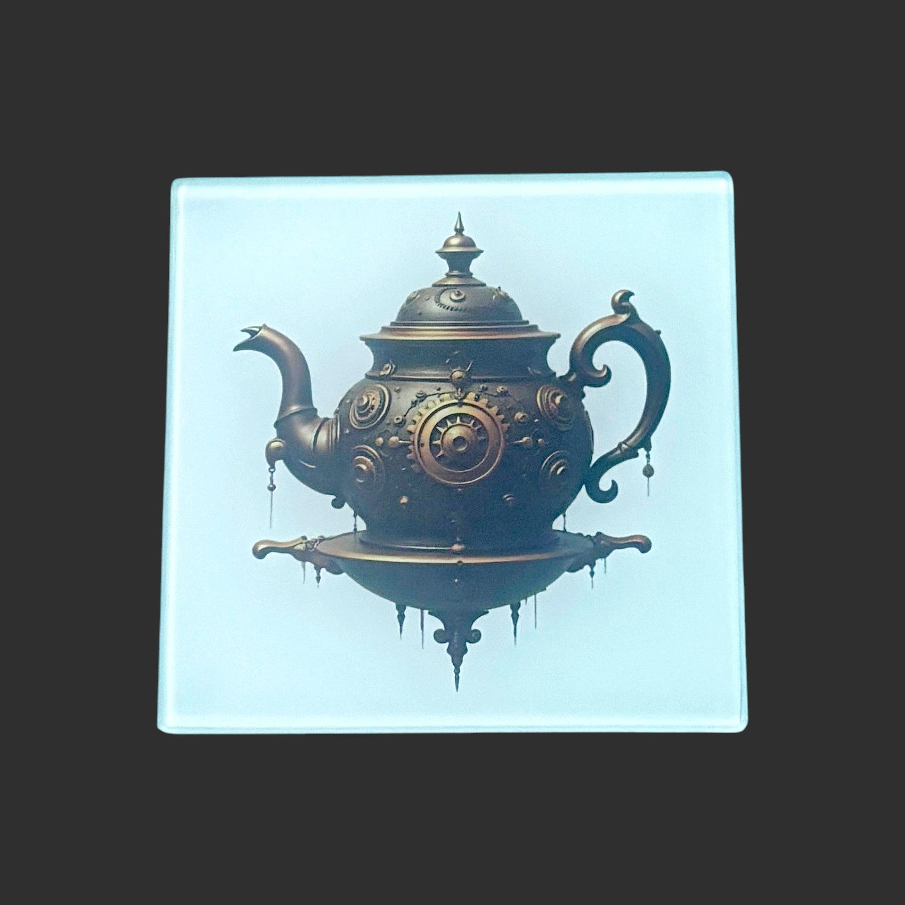 Illustrated Solutions Store square glass coaster featuring a bronze mechanical teapot with intricate steampunk gears.