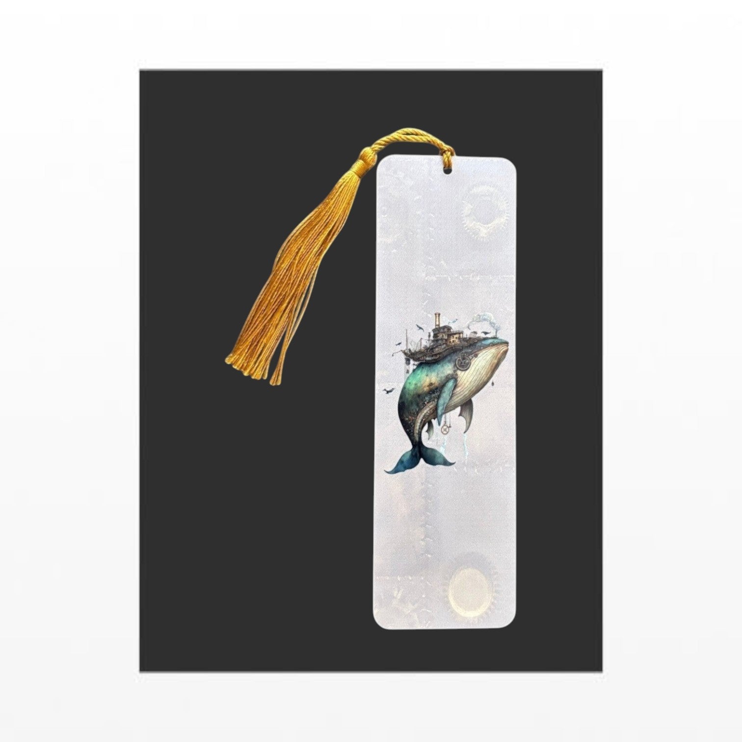 Illustrated Solutions Store steampunk whale bookmark made of durable aluminium with a vibrant gold tassel. Vertical view.
