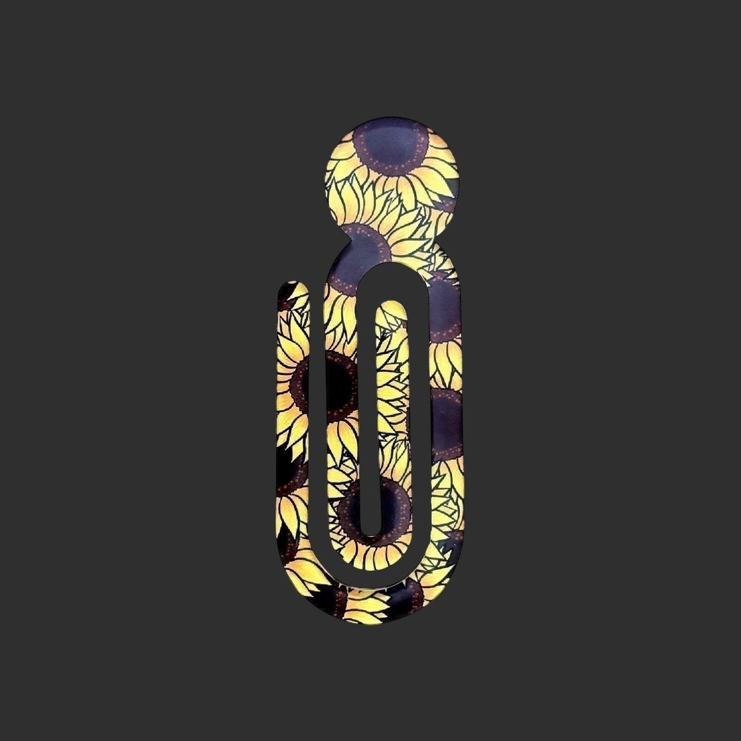 Illustrated Solutions Store acrylic book clip featuring a vibrant yellow sunflower pattern for journals and planners.