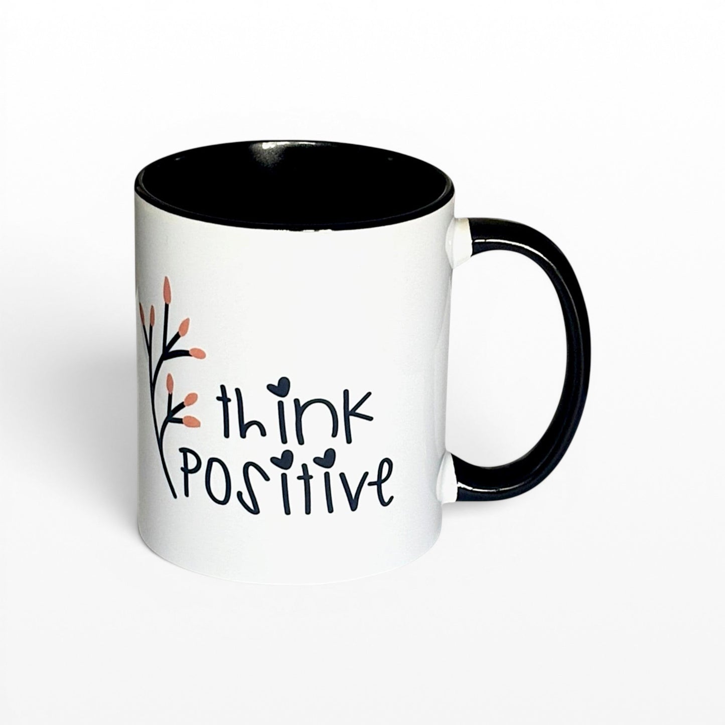 Illustrated Solutions Store white ceramic mug with black interior and handle, featuring the text "think POSITIVE" and a delicate floral branch.