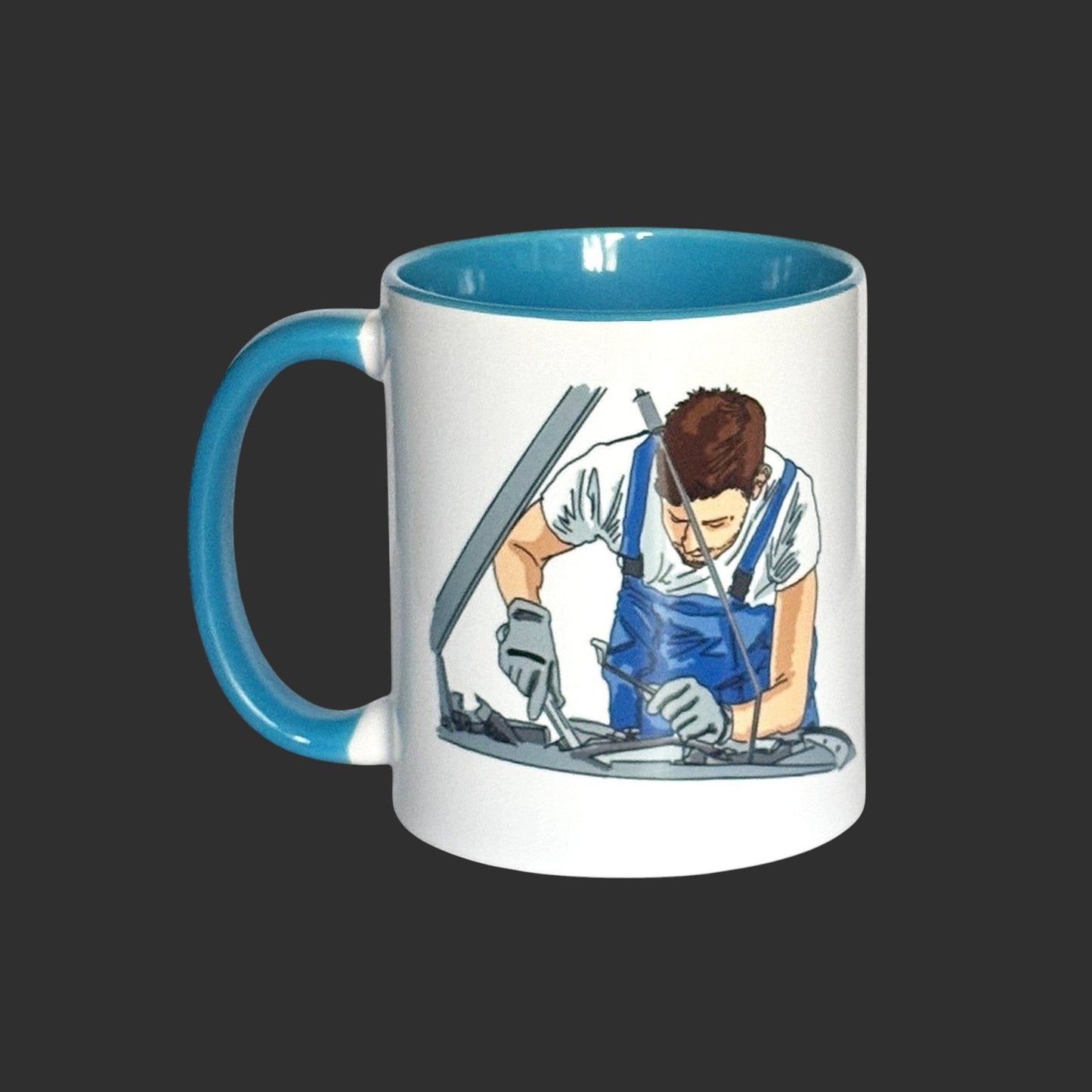 Illustrated Solutions Store white ceramic mug with blue handle and interior, featuring a mechanic working on a car engine.