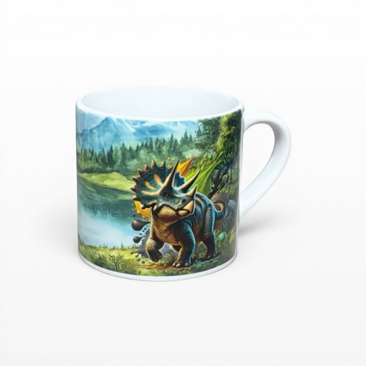 Illustrated Solutions Store kids mug with a Triceratops dinosaur in a prehistoric landscape. White ceramic mug, 6oz capacity.