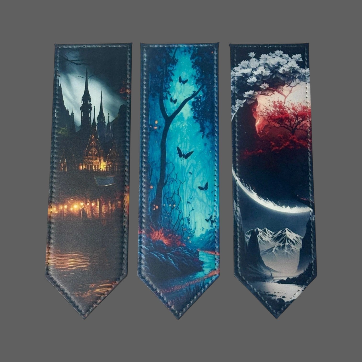 Illustrated Solutions Store set of 3 PU leather bookmarks: gothic castle, enchanted forest with butterflies, and celestial landscape with mountains.