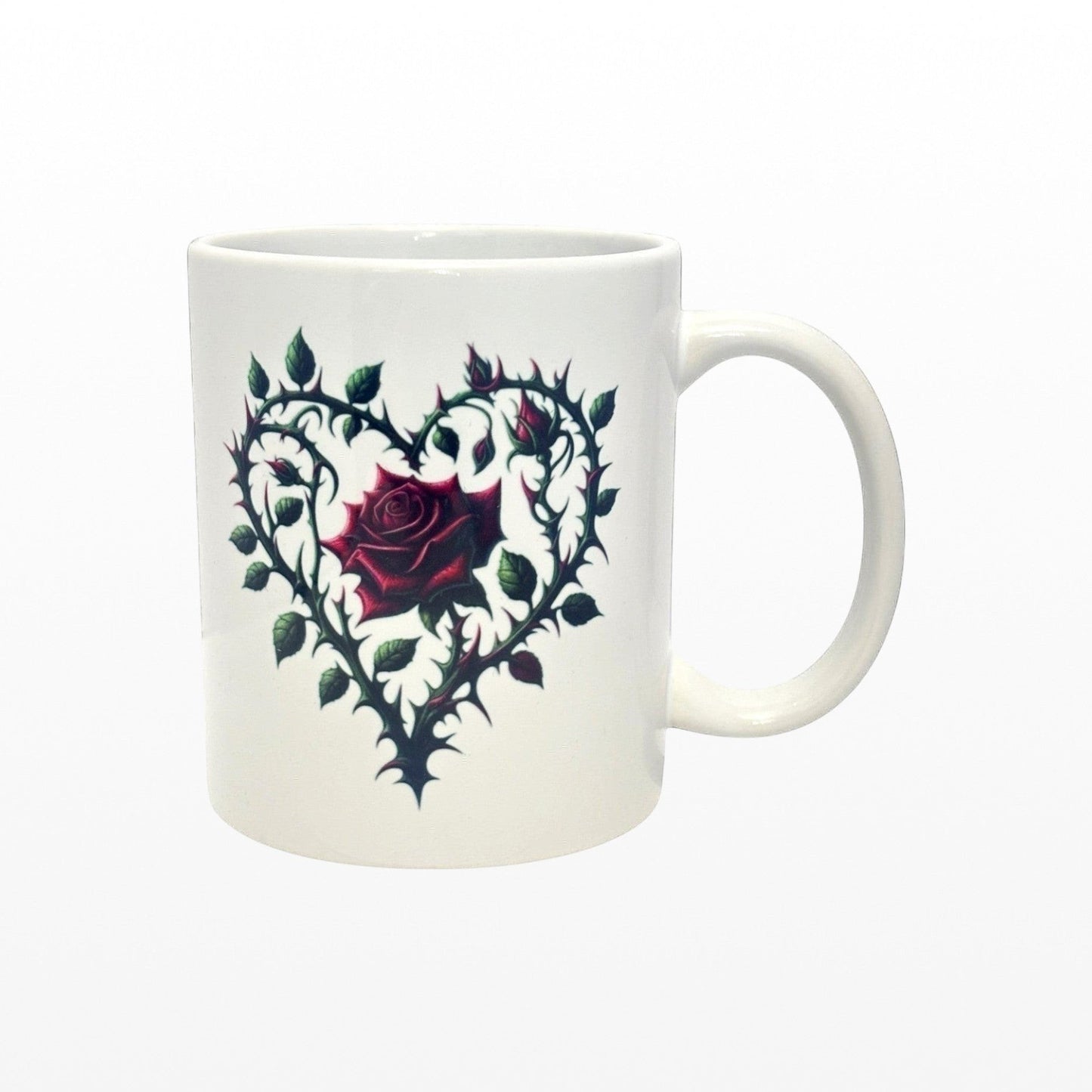 White mug with a heart-shaped design featuring a rose on a white background