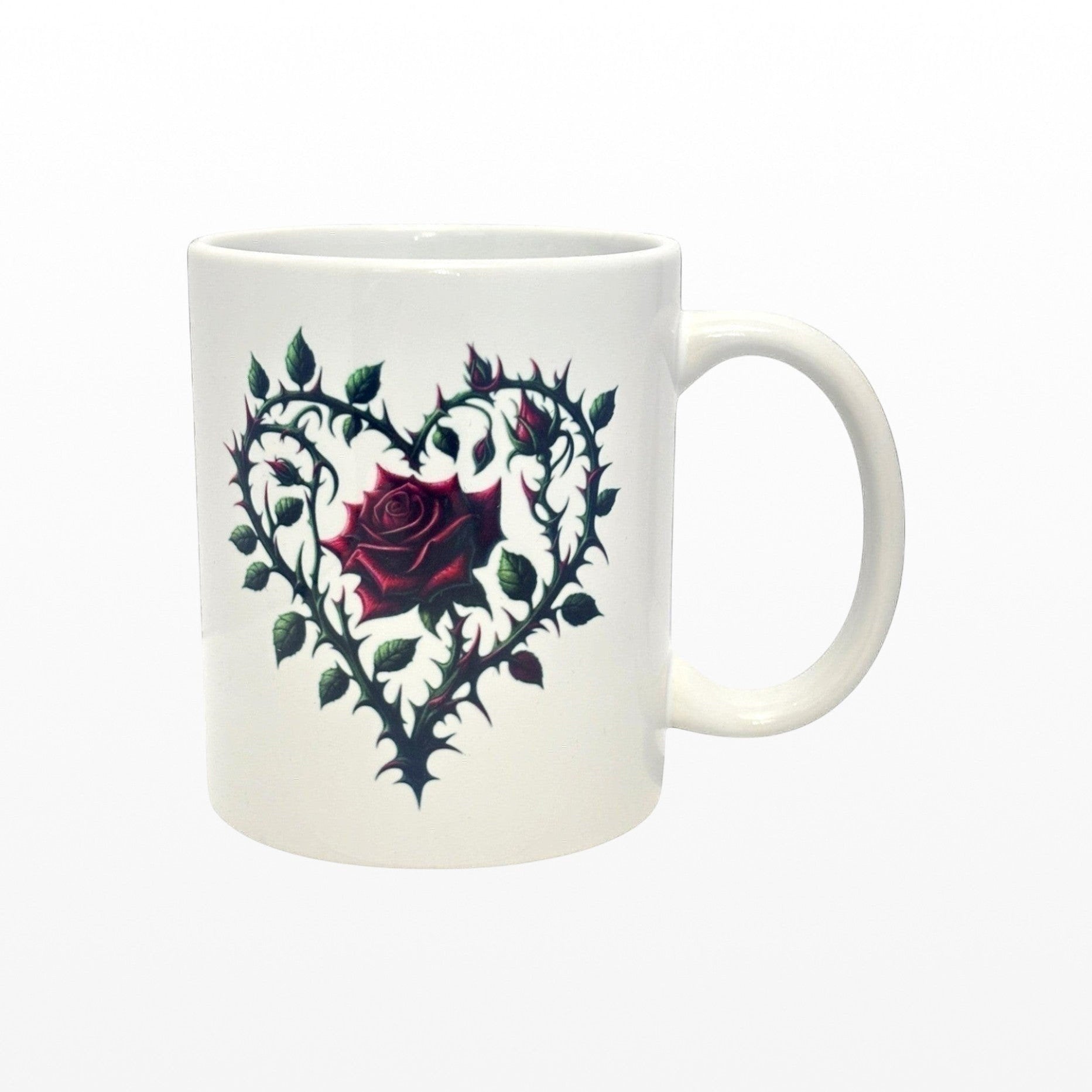 White mug with a heart-shaped design featuring a rose on a white background