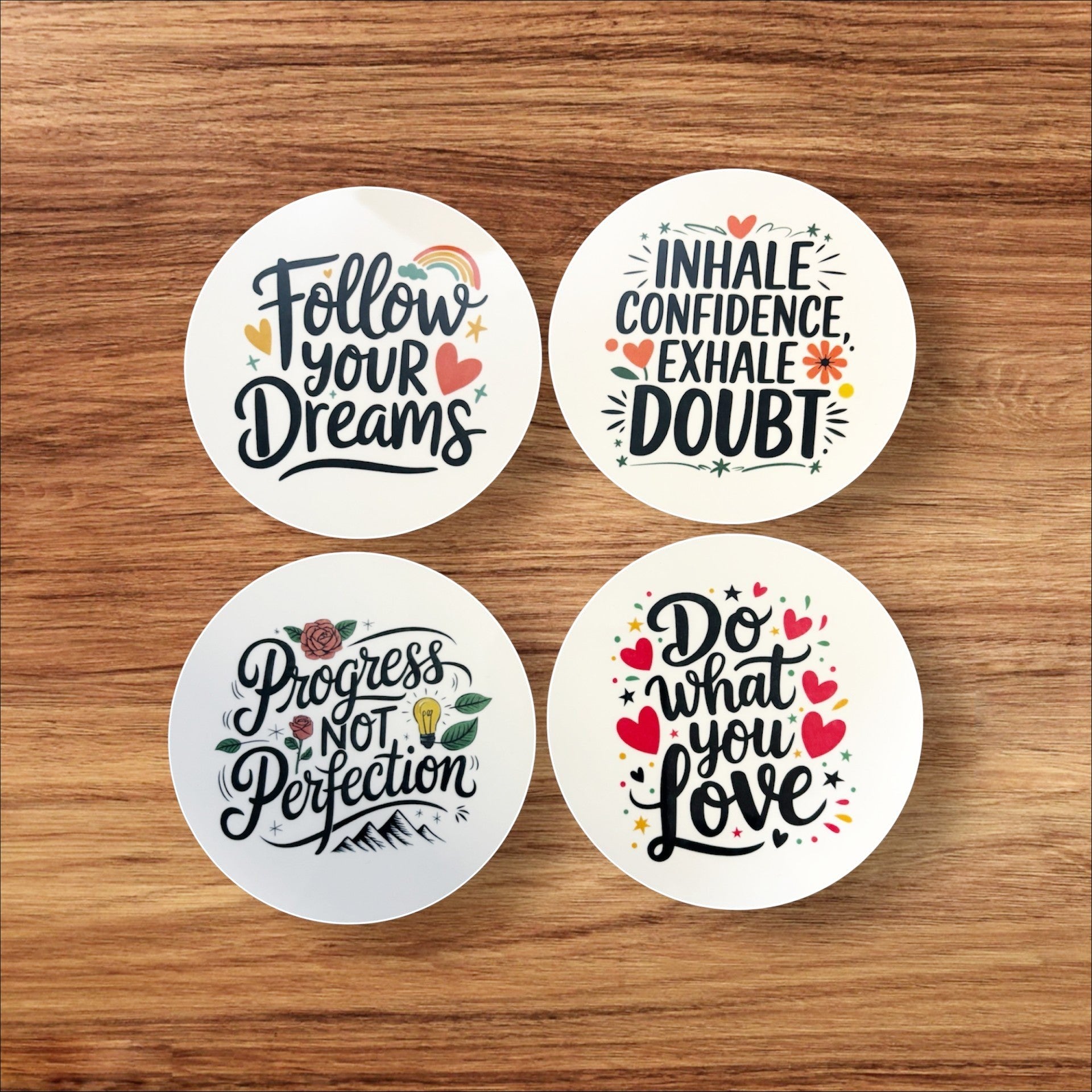 Illustrated Solutions Store motivational round MDF coasters with uplifting quotes like "Follow Your Dreams" and "Do What You Love."
