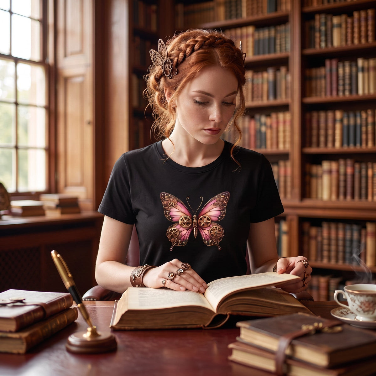 Lifestyle image of a woman wearing a black cotton T-shirt featuring an original pink steampunk butterfly illustration in a library setting.