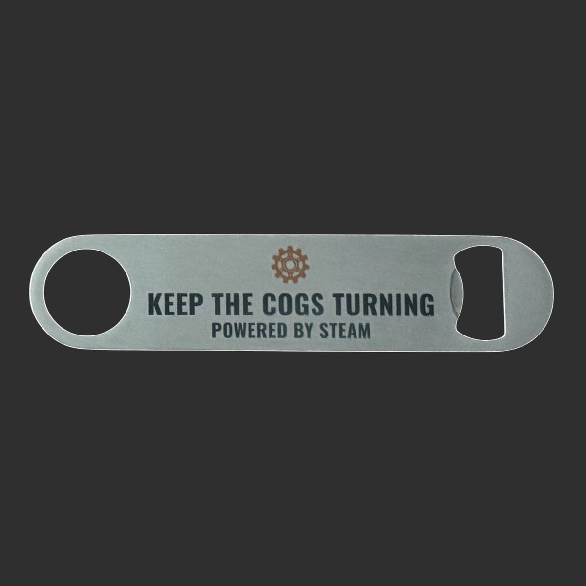 Steampunk bar blade bottle opener with Keep the Cogs Turning text and brown gear icon.